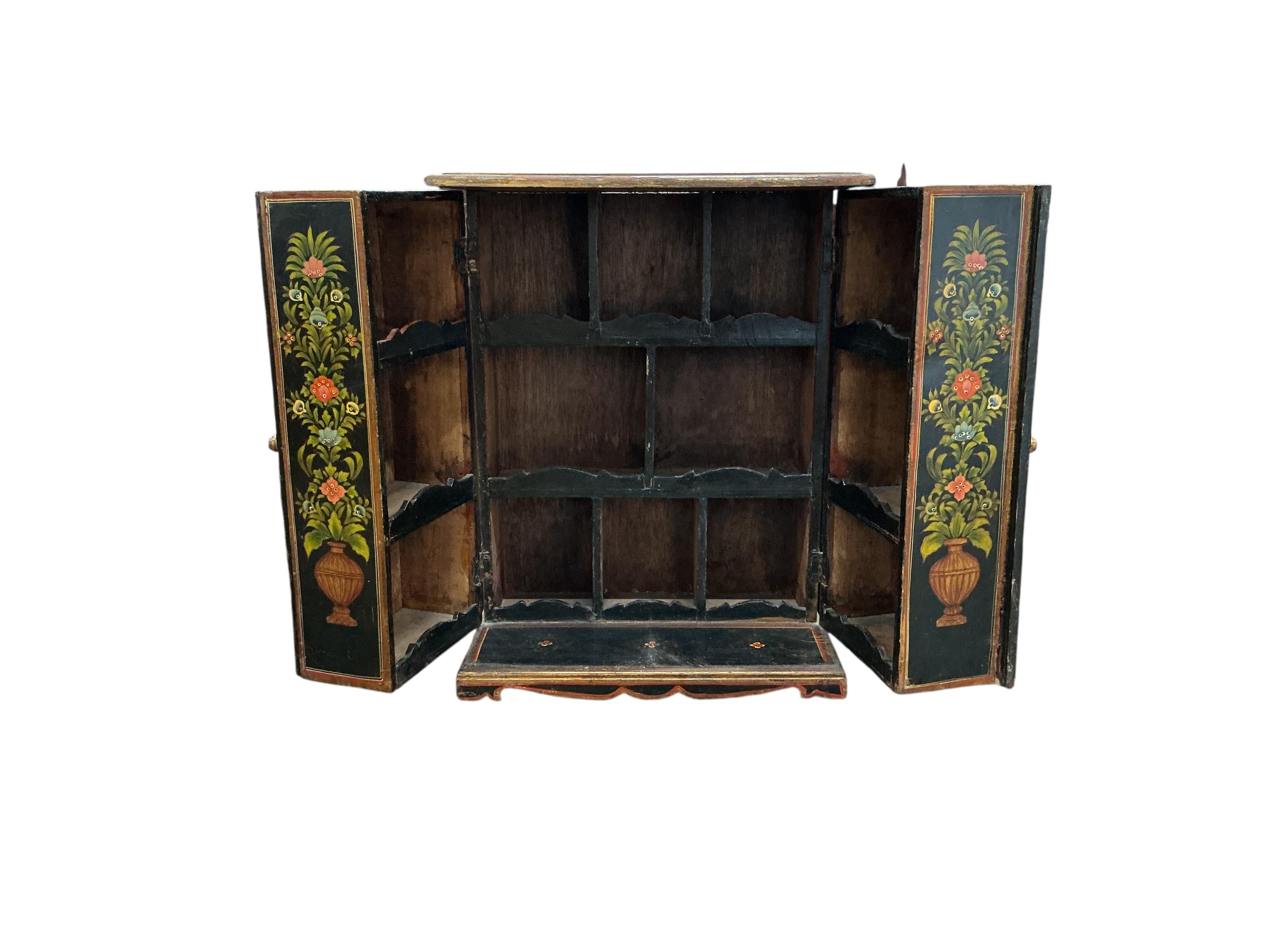An Indian painted table cabinet, width 46cm, depth 28cm, height 59cm